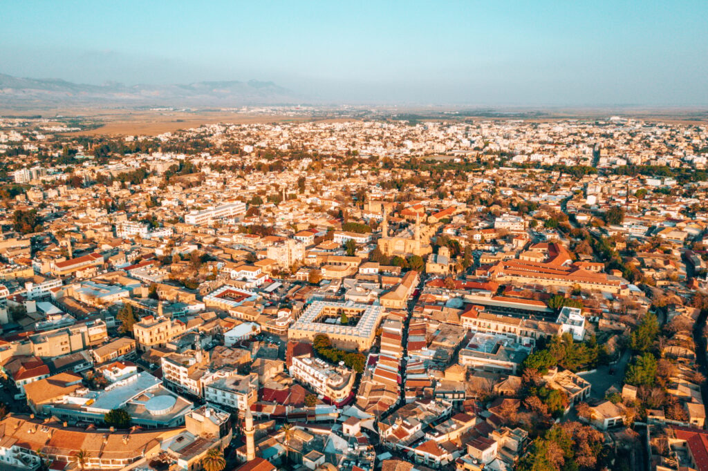 Discover Nicosia: A vibrant cityscape blending rich history with modern life, featuring lively streets, beautiful architecture, and peaceful spots.