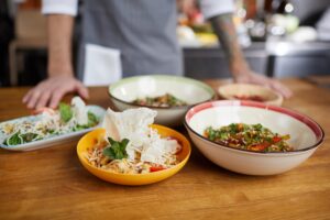 A variety of Asiatic dishes on a table at an Asiatic restaurant in Paphos, showcasing vibrant flavors and fresh ingredients.