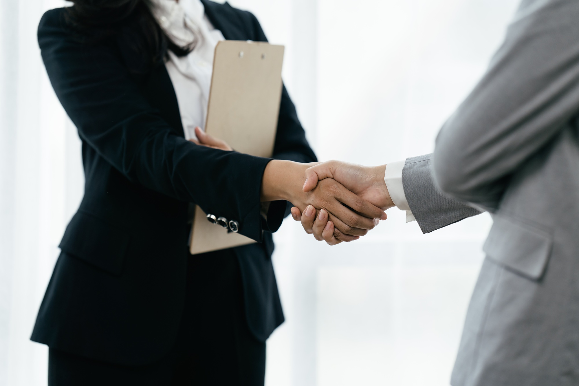 Business people shaking hands, finishing up meeting. business hand shake concept.