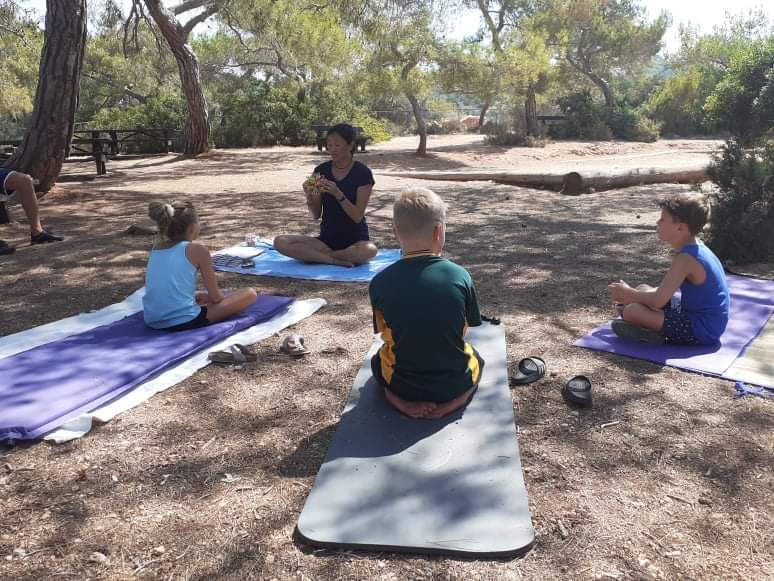 kids in the forest doing mindfulness in Cyprus